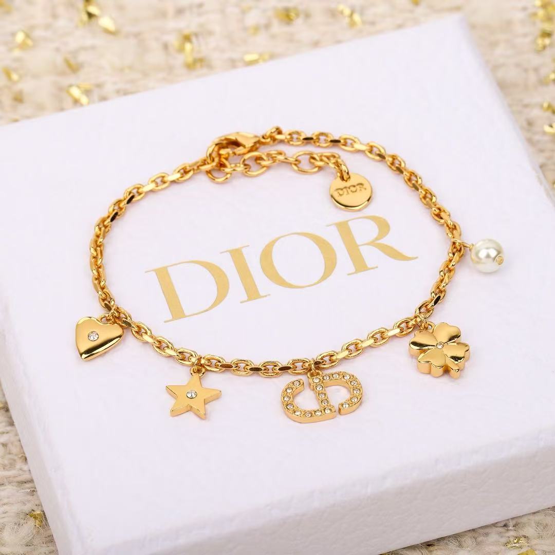 Dior Petit CD Lucky Charms bracelet Gold-tone metal with clear crystal accents and white faux pearl charm 17cm