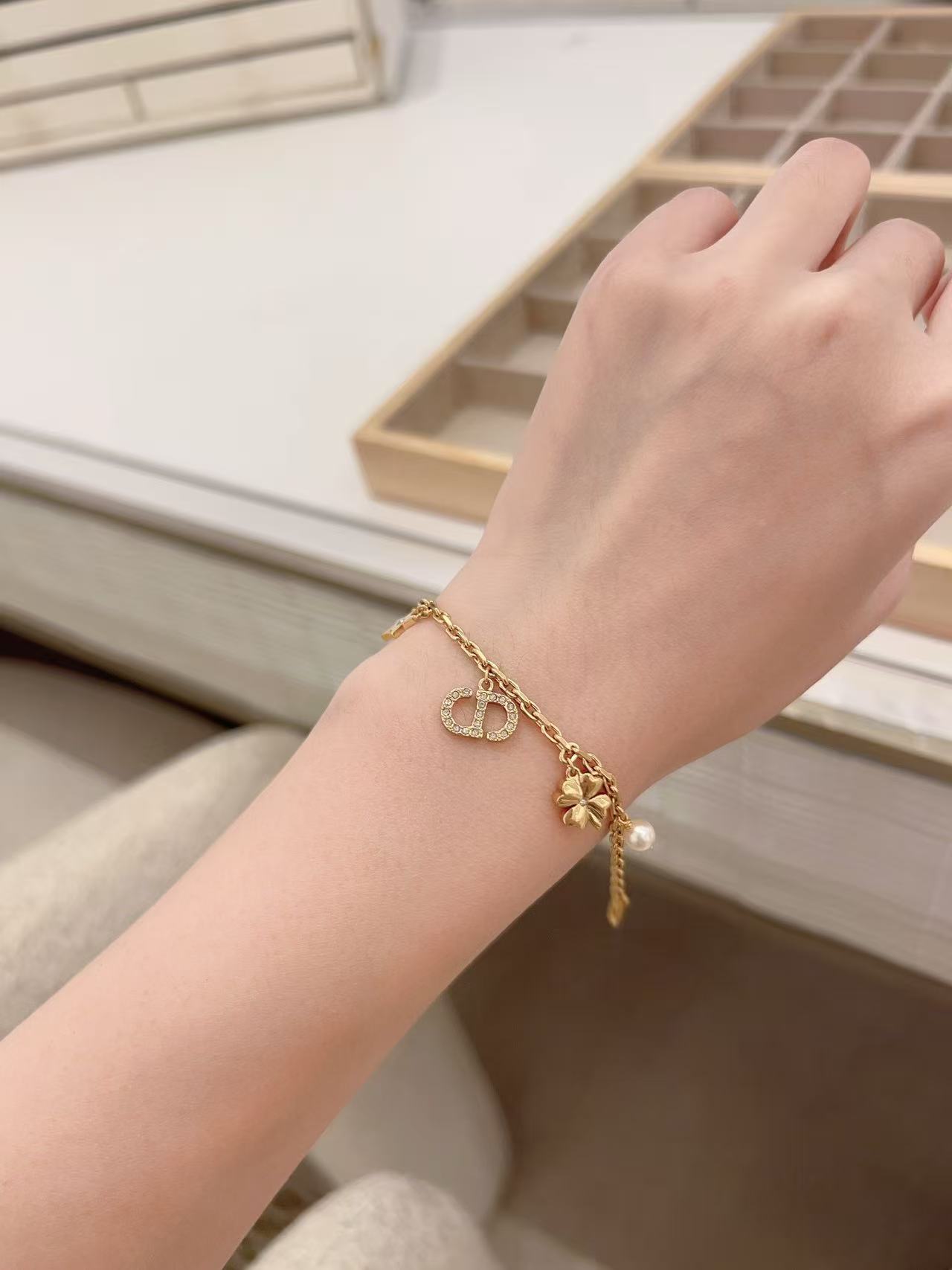 Dior Petit CD Lucky Charms bracelet Gold-tone metal with clear crystal accents and white faux pearl charm 17cm