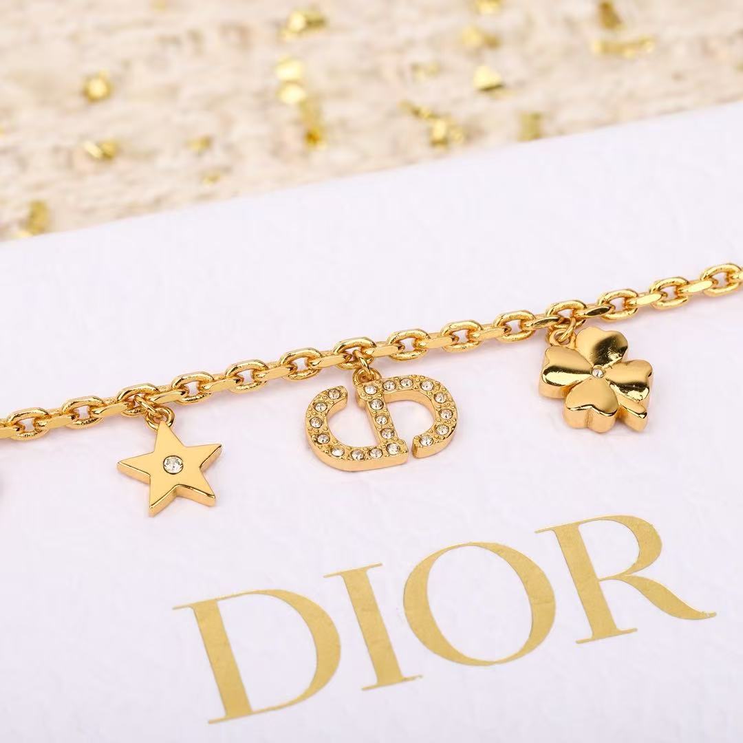 Dior Petit CD Lucky Charms bracelet Gold-tone metal with clear crystal accents and white faux pearl charm 17cm