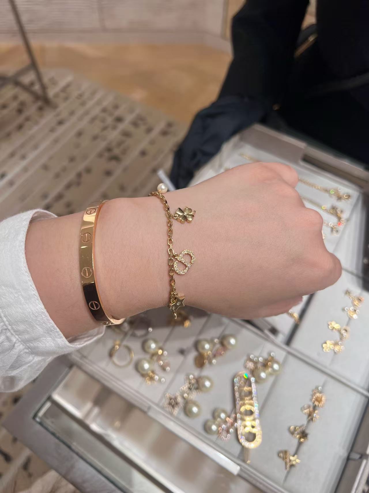 Dior Petit CD Lucky Charms bracelet Gold-tone metal with clear crystal accents and white faux pearl charm 17cm