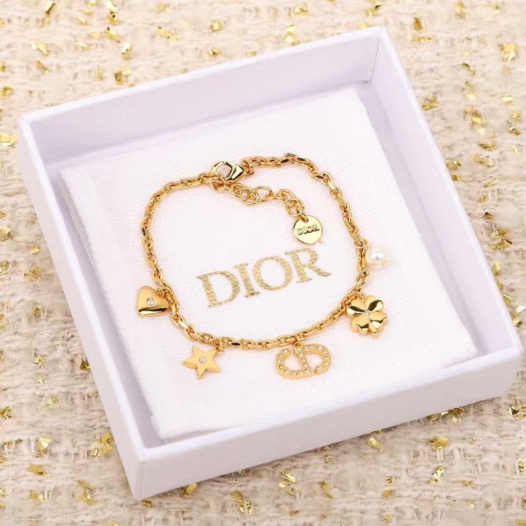 Dior Petit CD Lucky Charms bracelet Gold-tone metal with clear crystal accents and white faux pearl charm 17cm