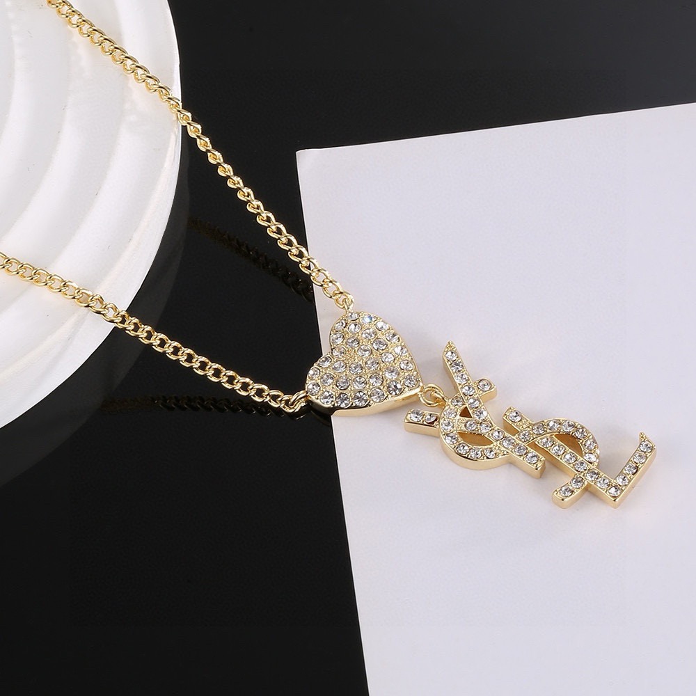 Saint Laurent YSL Monogram Heart Crystal Pendant necklace gold-tone metal with clear crystal accents 45cm with 5cm extender