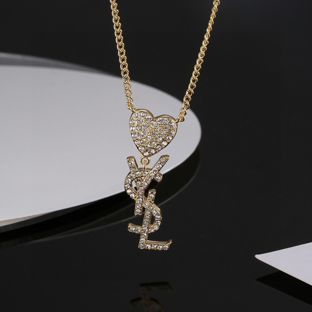 Saint Laurent YSL Monogram Heart Crystal Pendant necklace gold-tone metal with clear crystal accents 45cm with 5cm extender