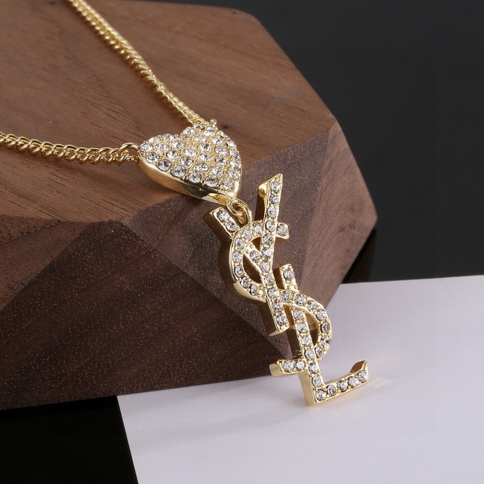 Saint Laurent YSL Monogram Heart Crystal Pendant necklace gold-tone metal with clear crystal accents 45cm with 5cm extender