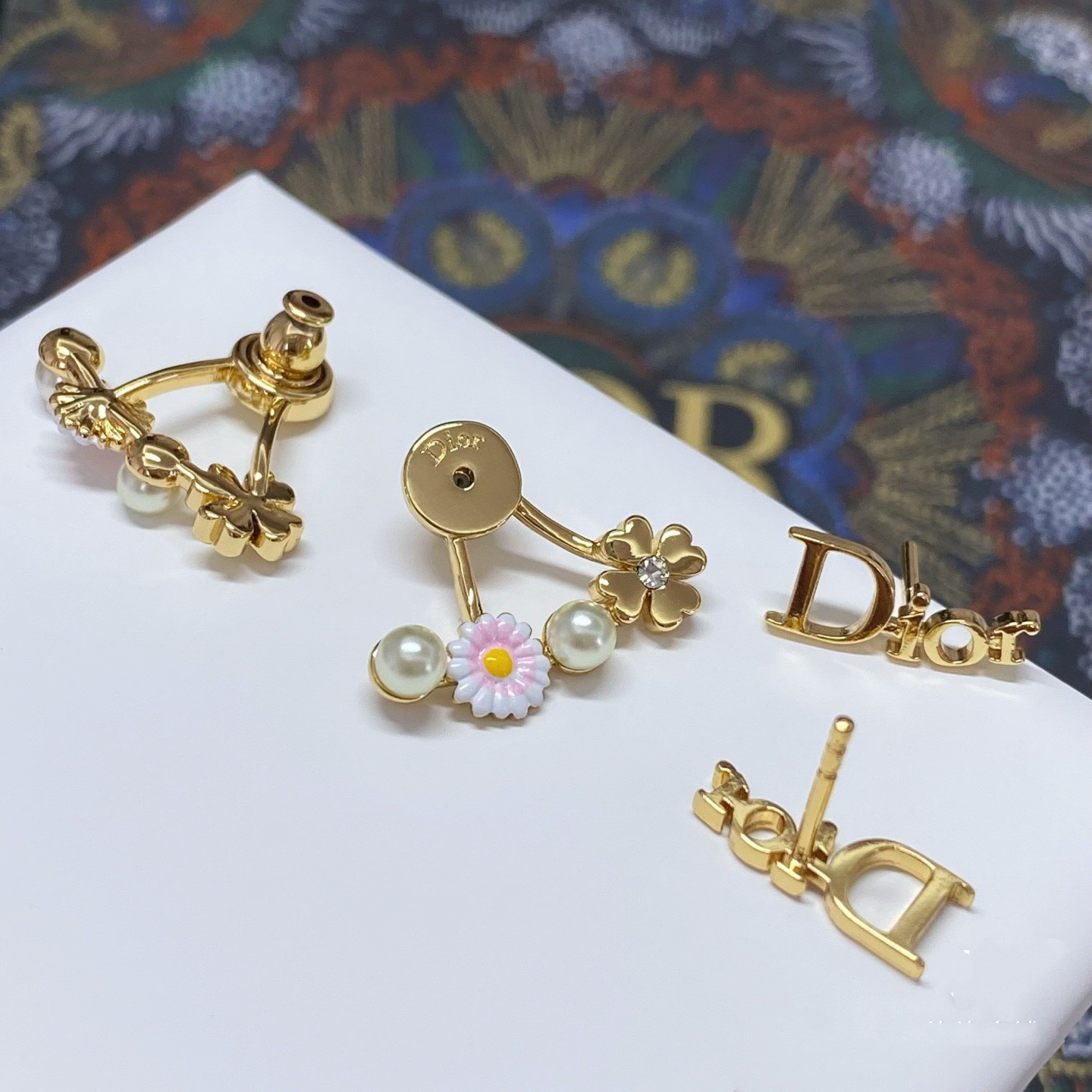 Dior Dio r evolution Daisy Clover Ear Jacket earrings Gold-tone metal white faux pearls pink and white enamel daisy with yellow center clear crystal accent on clover charm One Size post style 1 8cm drop length
