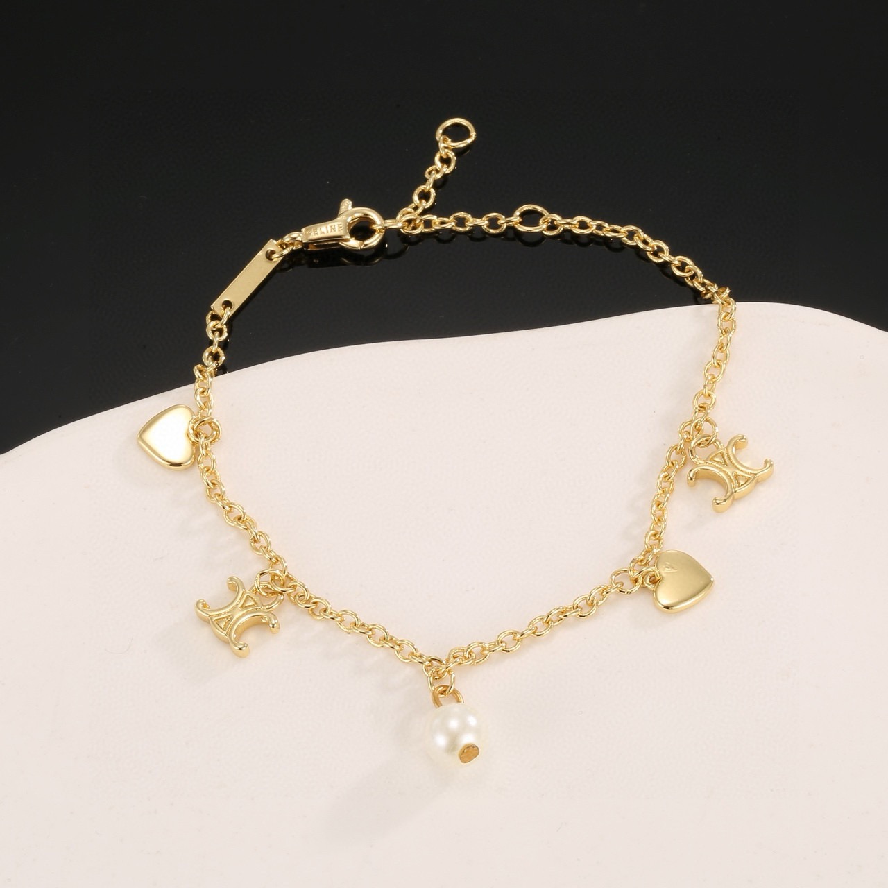 Celine Triomphe Heart Pearl Charm Bracelet bracelet gold-tone metal with white pearl 18cm with 3cm extender