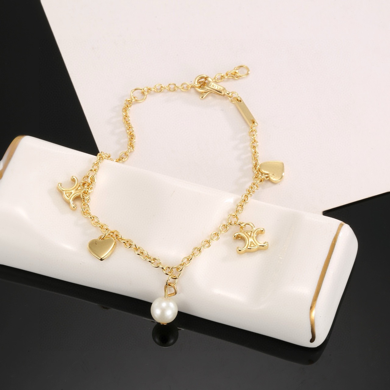 Celine Triomphe Heart Pearl Charm Bracelet bracelet gold-tone metal with white pearl 18cm with 3cm extender