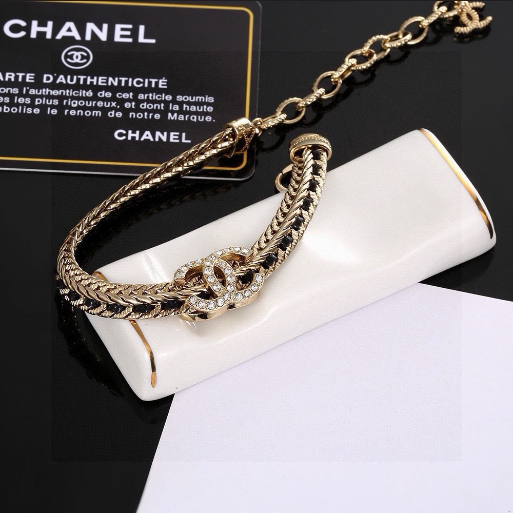 Chanel CC Crystal Woven Chain Bracelet bracelet Light gold tone metal with black woven leather inlay and clear crystal accents 18cm with 5cm extension