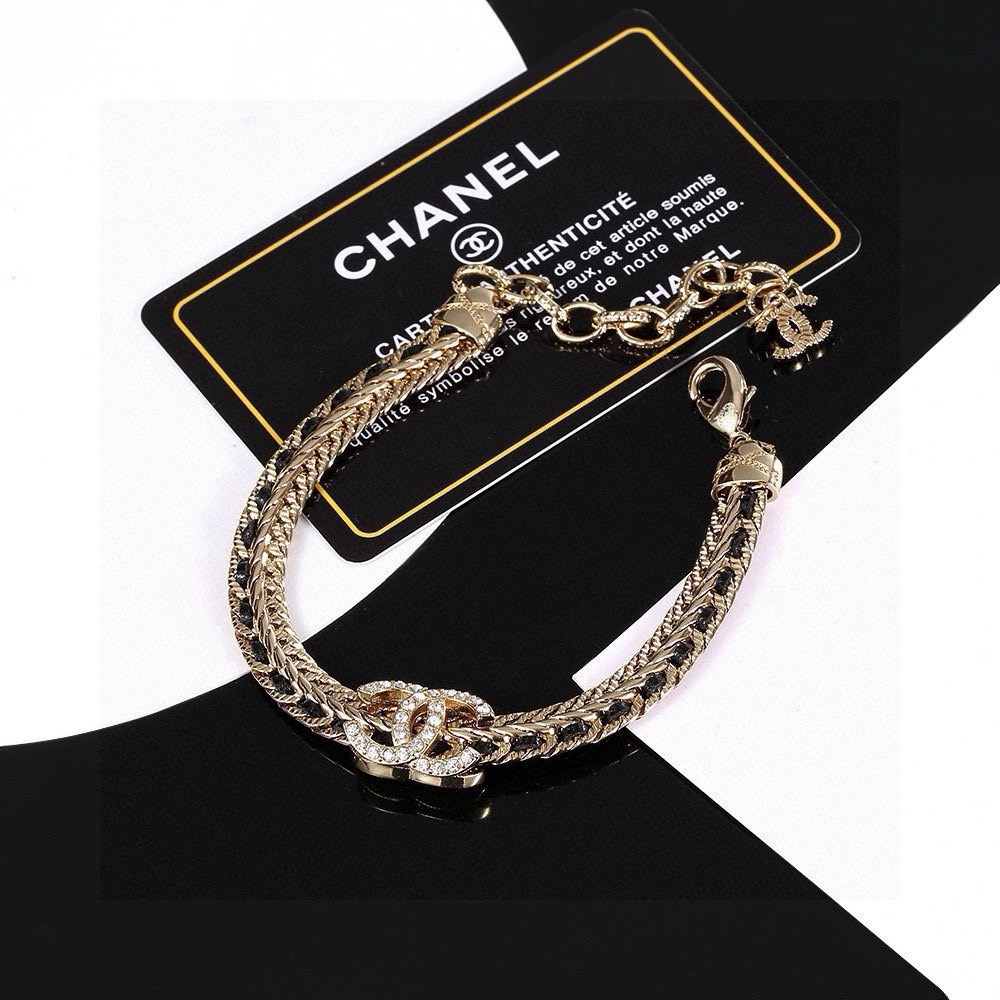 Chanel CC Crystal Woven Chain Bracelet bracelet Light gold tone metal with black woven leather inlay and clear crystal accents 18cm with 5cm extension