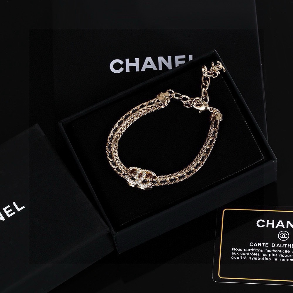 Chanel CC Crystal Woven Chain Bracelet bracelet Light gold tone metal with black woven leather inlay and clear crystal accents 18cm with 5cm extension