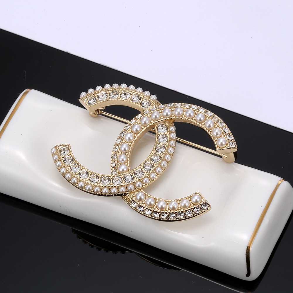 Chanel CC Logo Brooch brooch gold-tone metal white faux pearls clear crystals 3 5cm width
