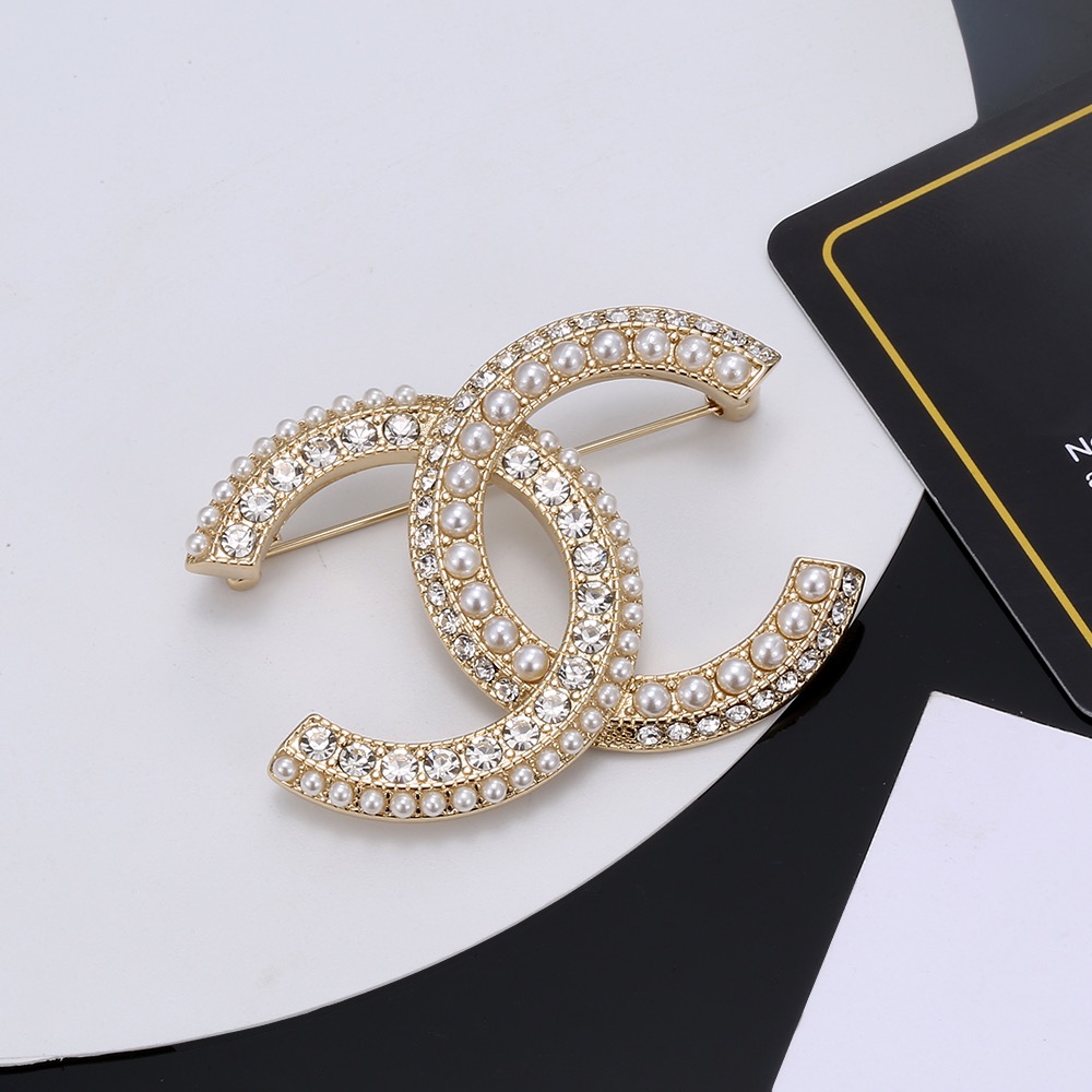 Chanel CC Logo Brooch brooch gold-tone metal white faux pearls clear crystals 3 5cm width