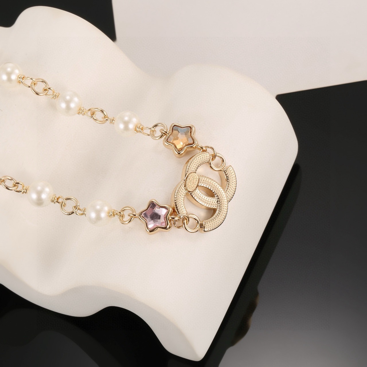 Chanel CC Logo Multicolor Star Pearl Bracelet bracelet Gold-tone metal white faux pearls clear crystals multicolor star stones blue pink purple yellow champagne 18cm with 5cm extension chain