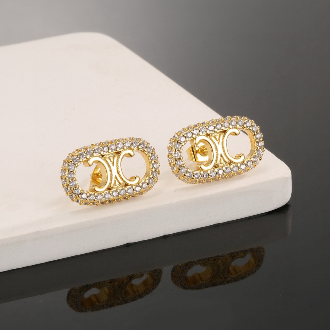 Celine Triomphe Crystal Pave Oval Stud Earrings earrings gold-tone metal with clear pave crystals 1 5cm length per earring