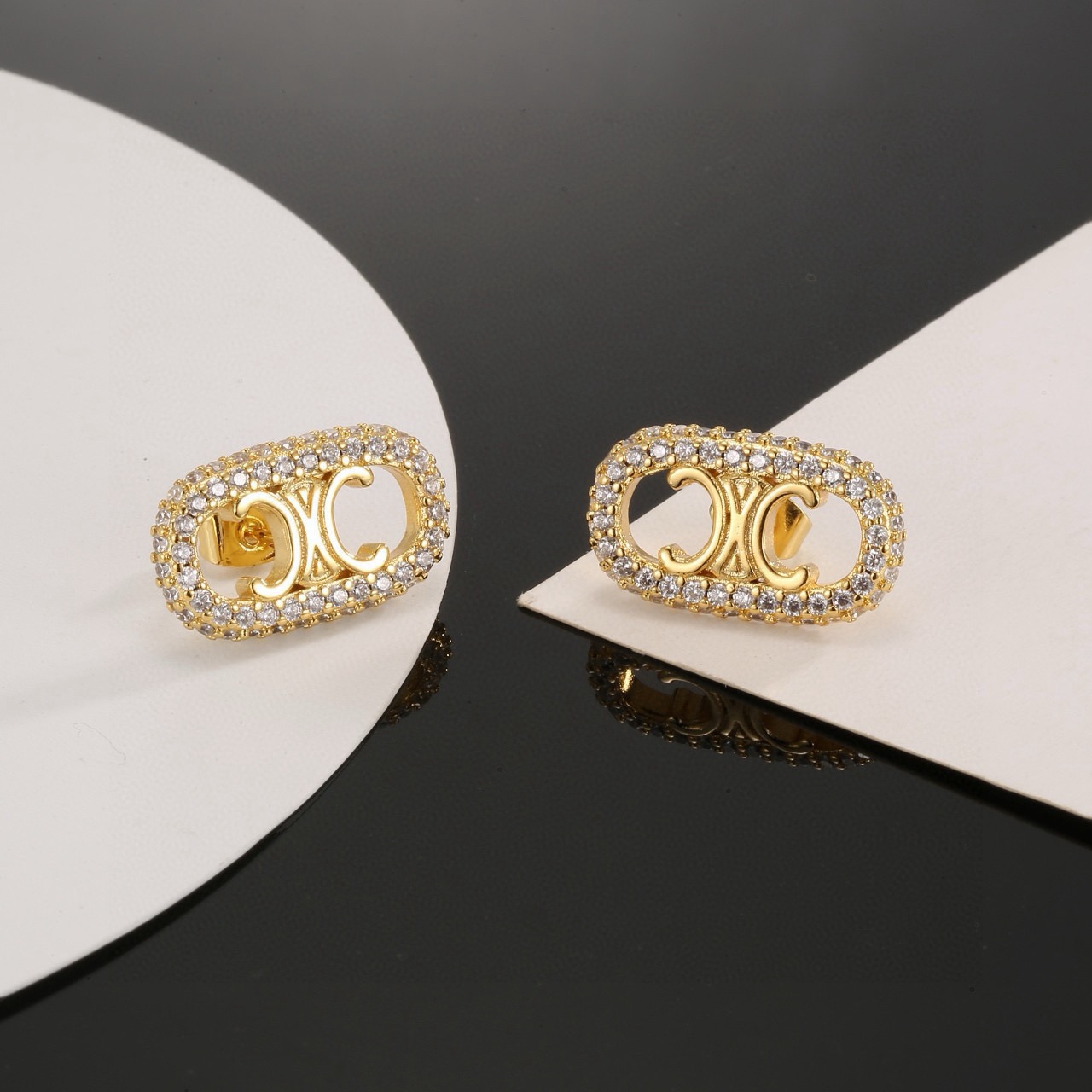 Celine Triomphe Crystal Pave Oval Stud Earrings earrings gold-tone metal with clear pave crystals 1 5cm length per earring