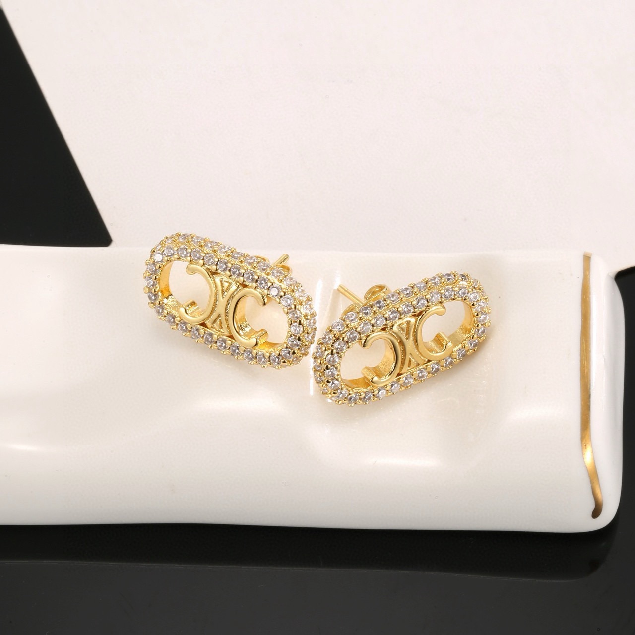 Celine Triomphe Crystal Pave Oval Stud Earrings earrings gold-tone metal with clear pave crystals 1 5cm length per earring