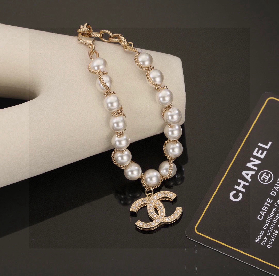 Chanel CC Pearl Charm necklace gold-tone metal white faux pearl clear crystal 42cm
