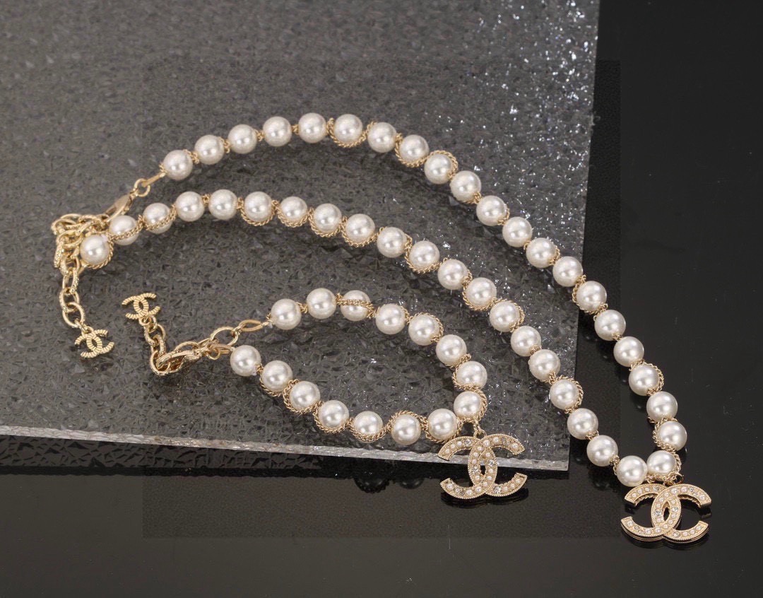 Chanel CC Pearl Charm necklace gold-tone metal white faux pearl clear crystal 42cm