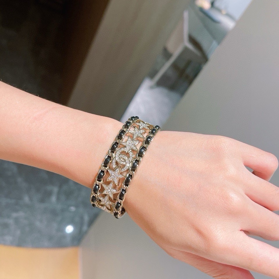 Chanel CC Star Crystal Chain Cuff bracelet Gold-tone metal black leather clear crystal One Size Open