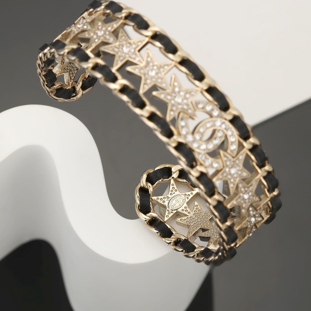 Chanel CC Star Crystal Chain Cuff bracelet Gold-tone metal black leather clear crystal One Size Open