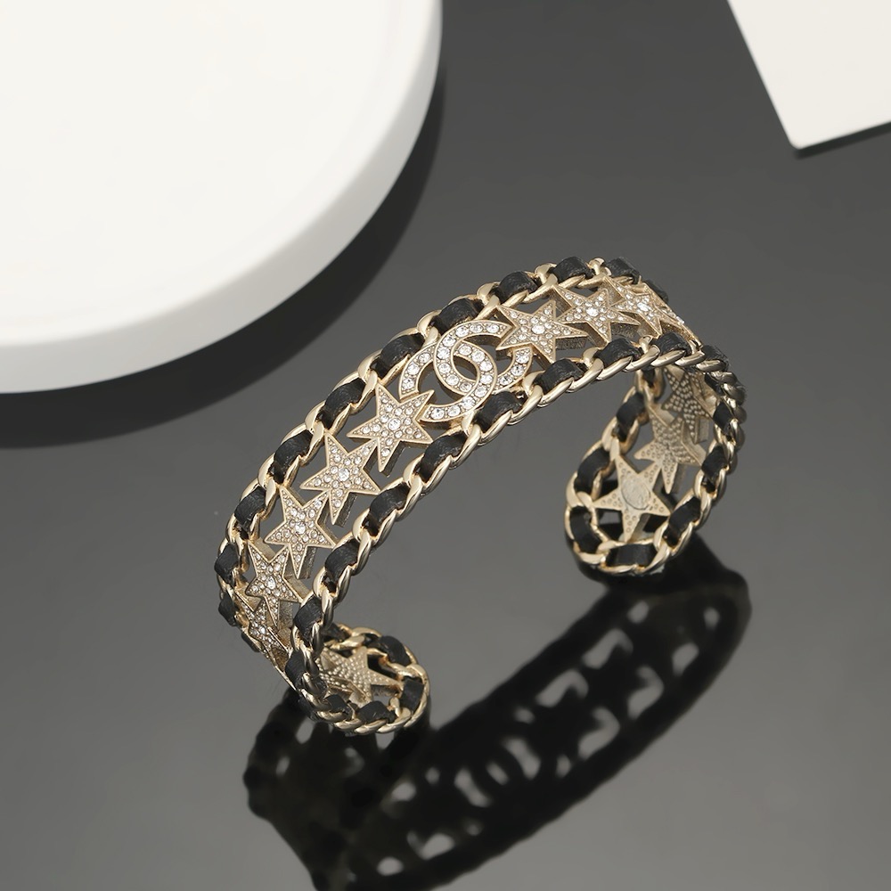 Chanel CC Star Crystal Chain Cuff bracelet Gold-tone metal black leather clear crystal One Size Open