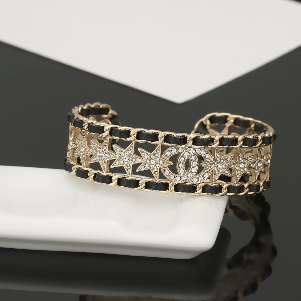 Chanel CC Star Crystal Chain Cuff bracelet Gold-tone metal black leather clear crystal One Size Open
