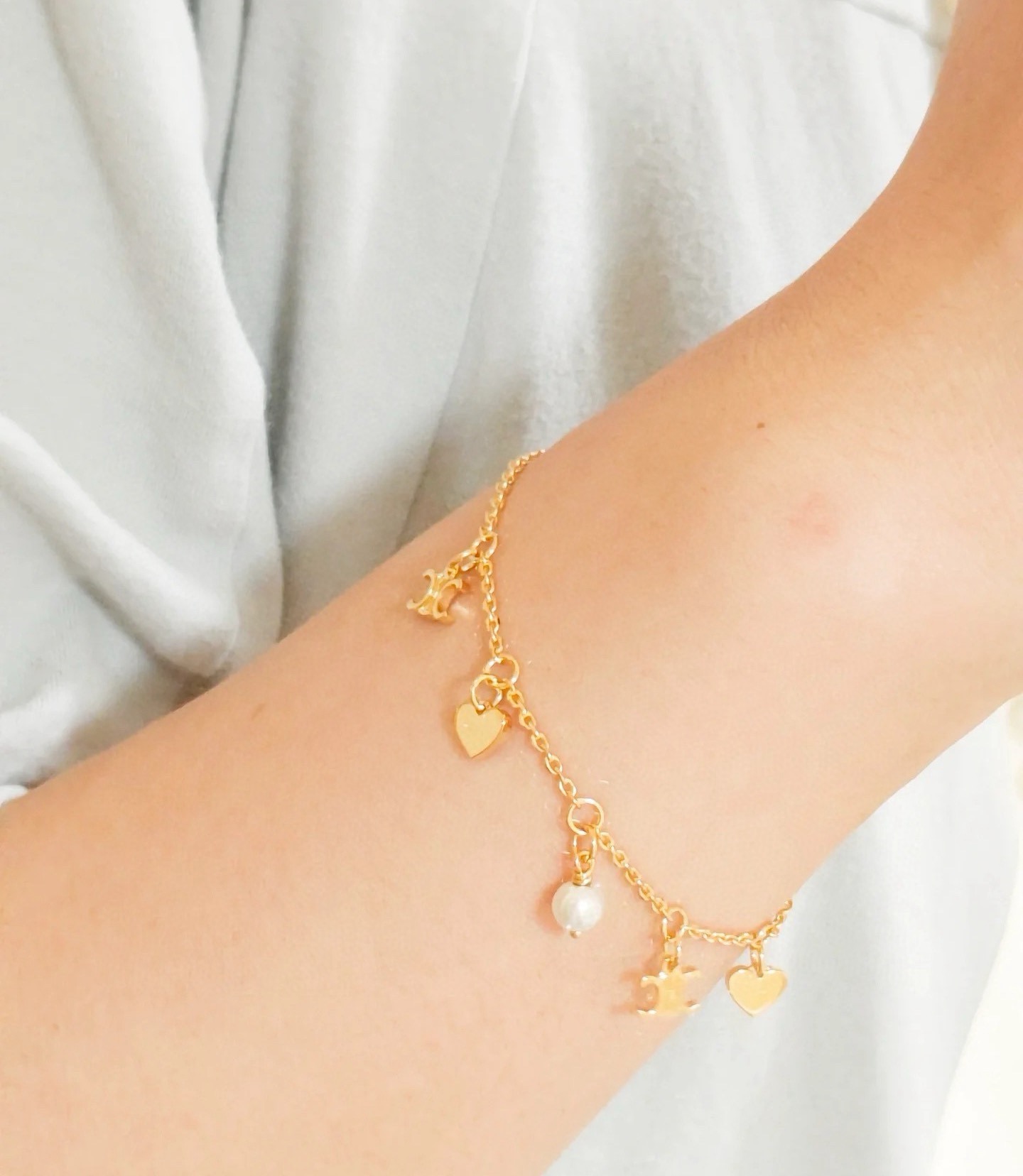Celine Triomphe Heart Pearl Charm Bracelet bracelet gold-tone metal with white faux pearl 18cm with 3cm extender