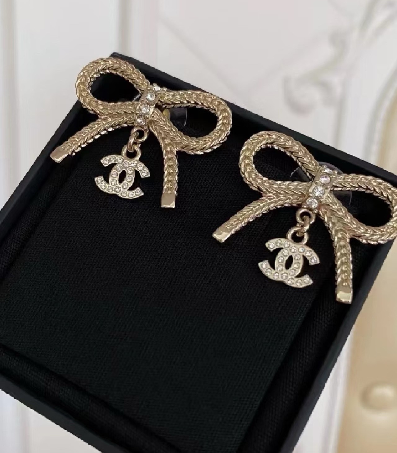 Chanel CC Logo Bow Drop Earrings earrings Light gold-tone metal with clear crystal accents One Size
