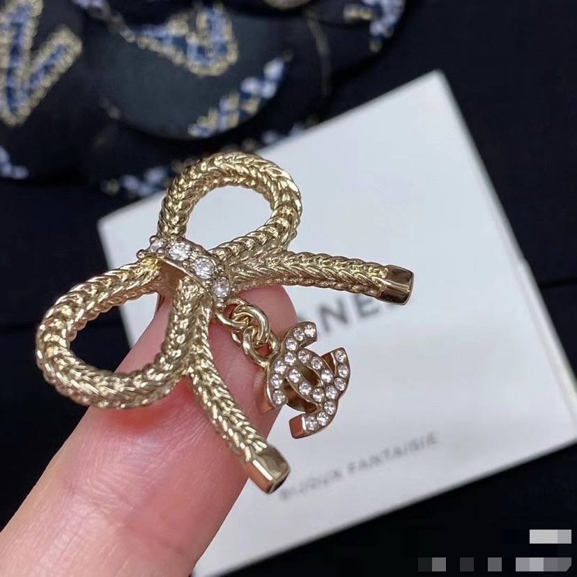 Chanel CC Logo Bow Drop Earrings earrings Light gold-tone metal with clear crystal accents One Size