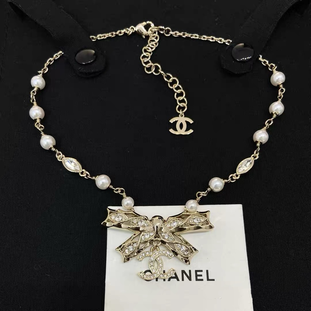 Chanel Crystal Bow CC Pearl Necklace necklace Light gold tone metal white faux pearls clear crystals 42cm with 5cm extender