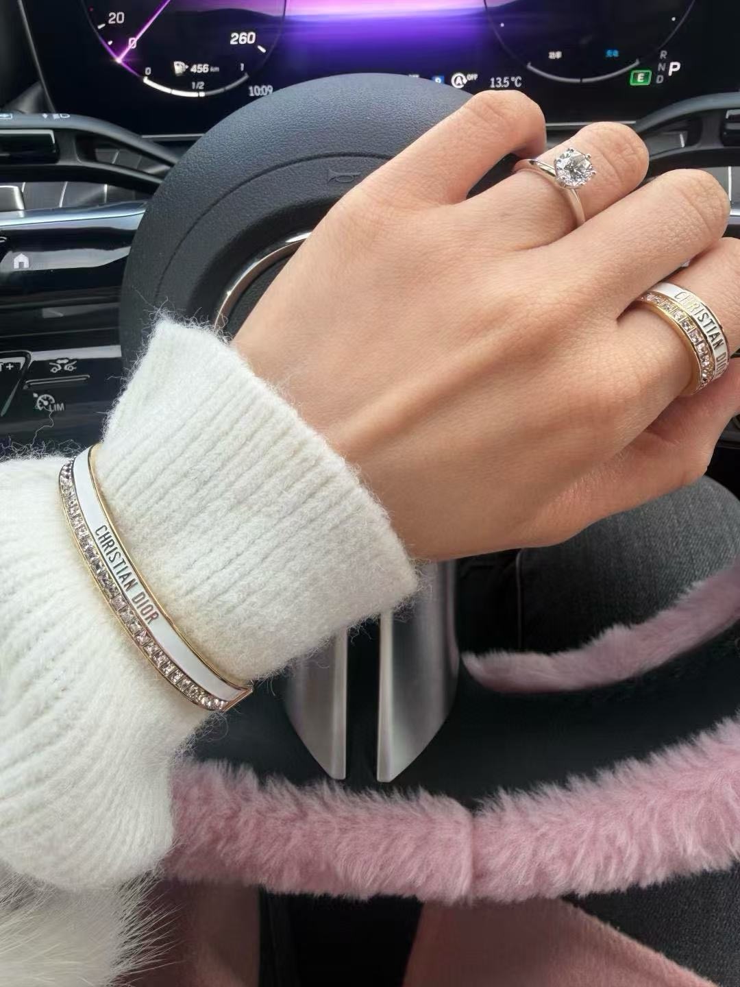 Dior CD New Christian Dior Signature Bangle bracelet Gold-tone metal with clear channel-set crystals available with white or black enamel accent M 6 5cm inner diameter