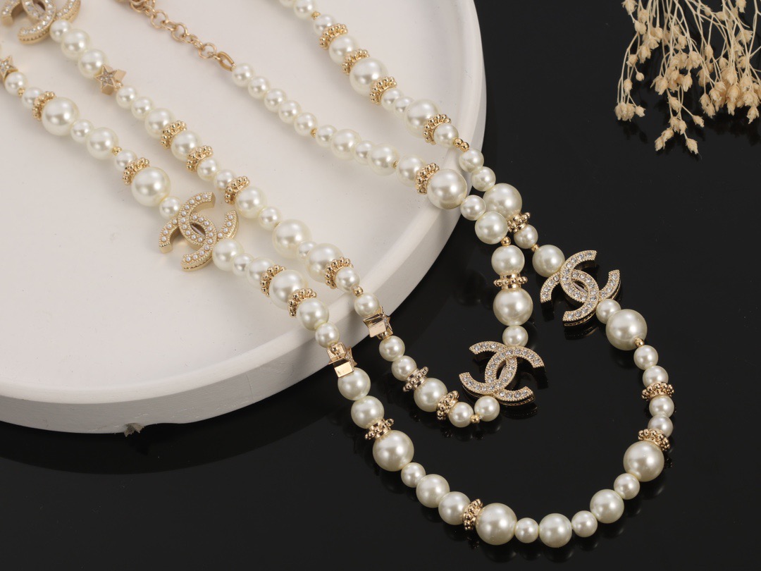 Chanel CC Logo Multi-Charm Pearl Long Necklace necklace Gold-tone metal cream white faux pearl clear crystal 80cm with 5cm extender chain