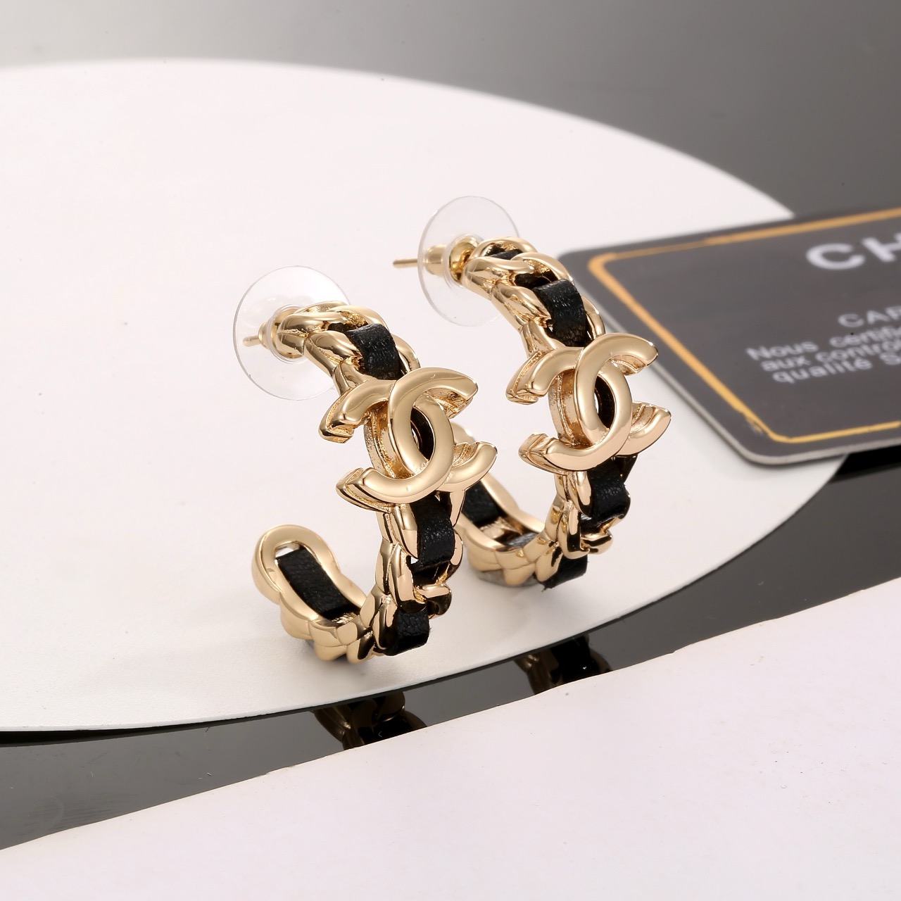 Chanel CC Interlocking Logo Leather Woven Chain Hoop Earrings earrings gold-tone metal with black leather inlay 2 5cm hoop diameter