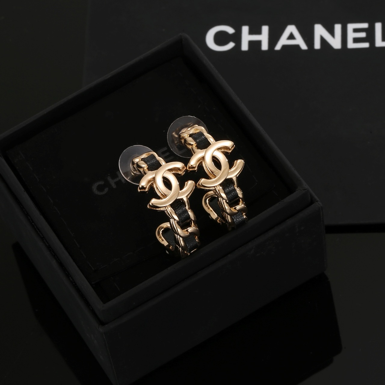 Chanel CC Interlocking Logo Leather Woven Chain Hoop Earrings earrings gold-tone metal with black leather inlay 2 5cm hoop diameter