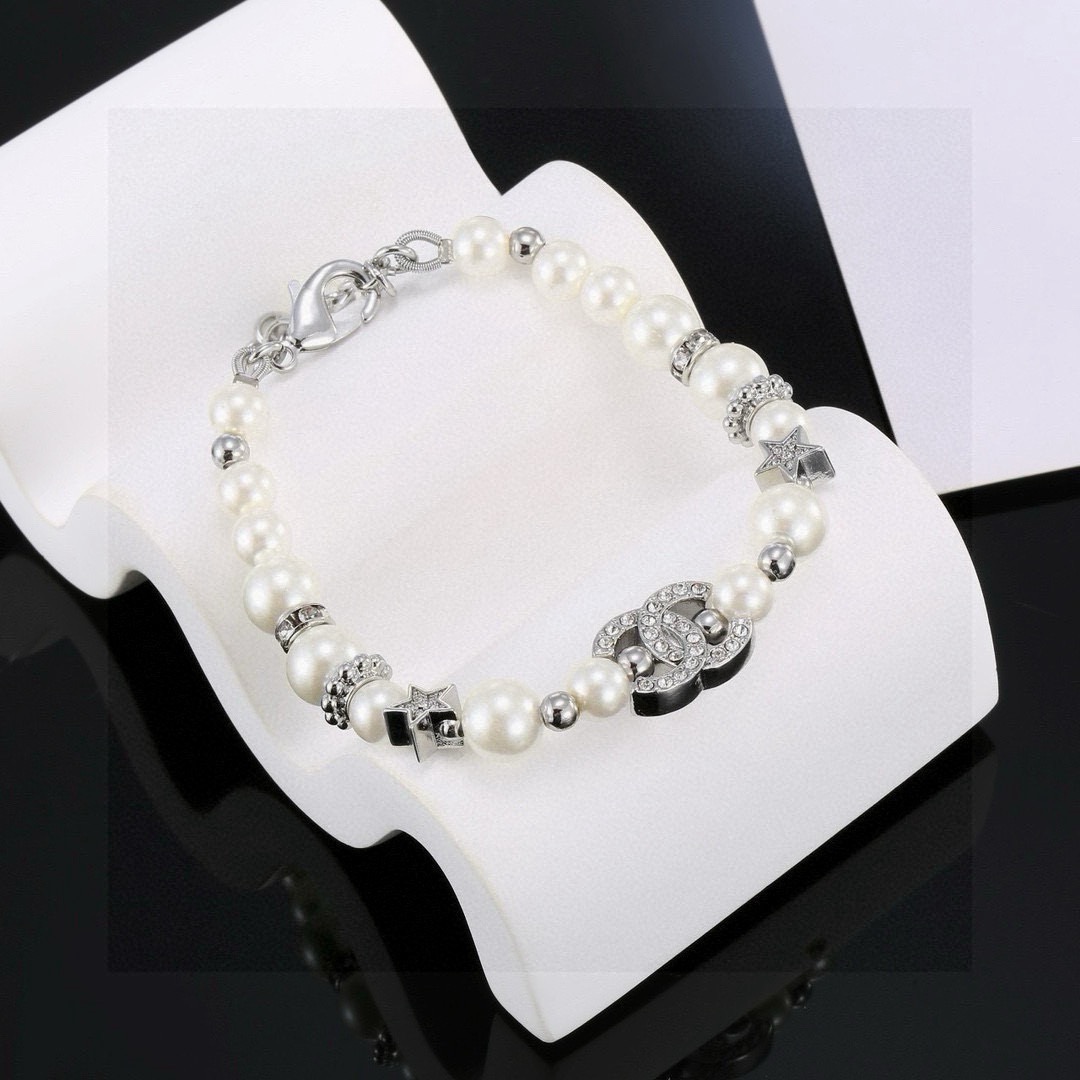 Chanel CC Logo Crystal Star Pearl Bracelet bracelet silver-tone metal white faux pearl clear crystal 18cm with 3cm extension chain