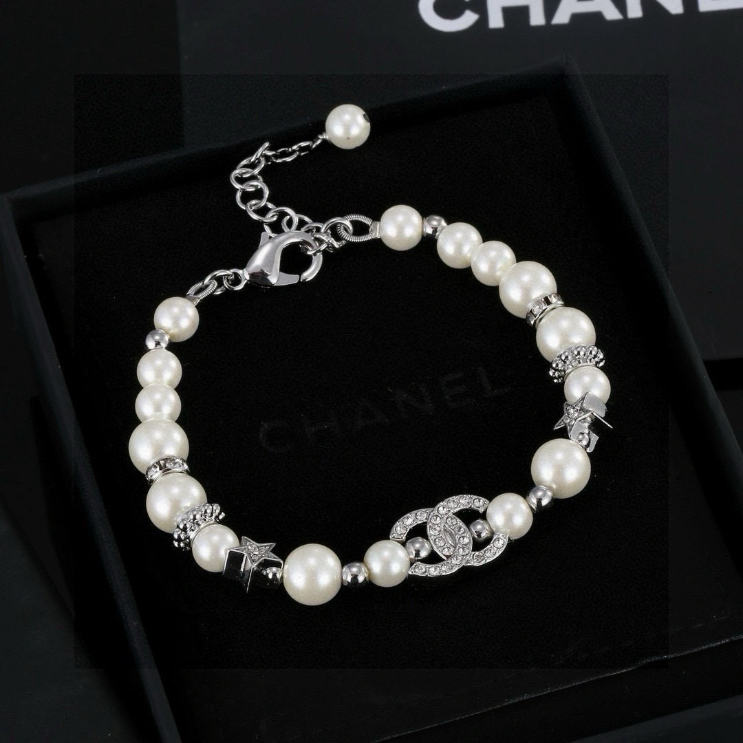Chanel CC Logo Crystal Star Pearl Bracelet bracelet silver-tone metal white faux pearl clear crystal 18cm with 3cm extension chain