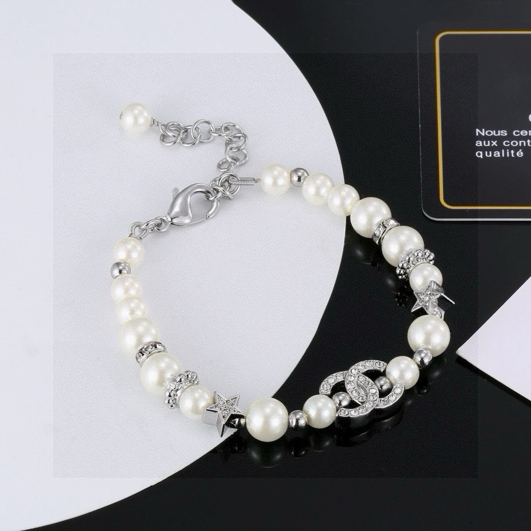 Chanel CC Logo Crystal Star Pearl Bracelet bracelet silver-tone metal white faux pearl clear crystal 18cm with 3cm extension chain