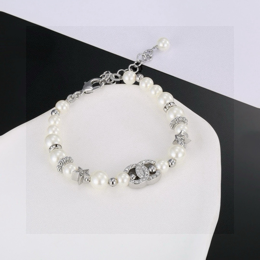 Chanel CC Logo Crystal Star Pearl Bracelet bracelet silver-tone metal white faux pearl clear crystal 18cm with 3cm extension chain
