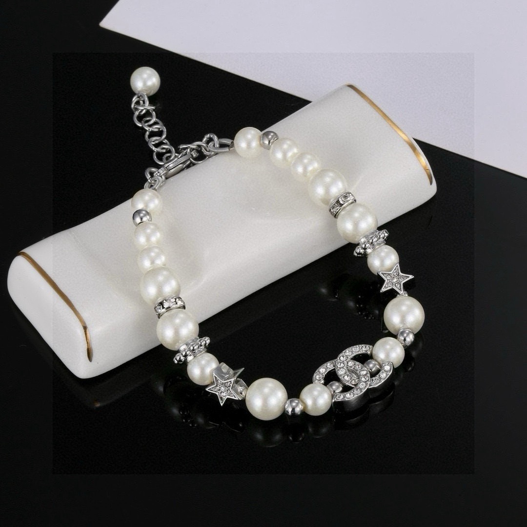 Chanel CC Logo Crystal Star Pearl Bracelet bracelet silver-tone metal white faux pearl clear crystal 18cm with 3cm extension chain