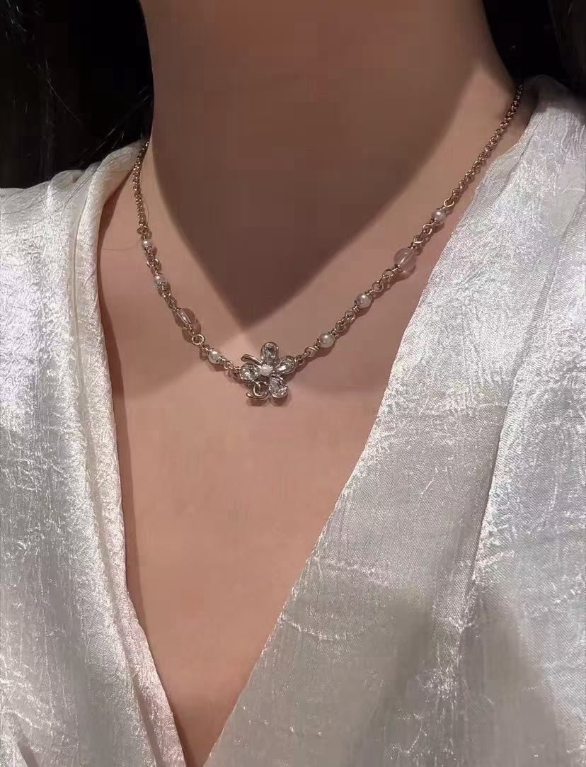 Chanel CC Clover Crystal Pearl Necklace necklace Light gold tone metal clear faceted crystal white faux pearl transparent resin bead 42cm with 5cm extender chain