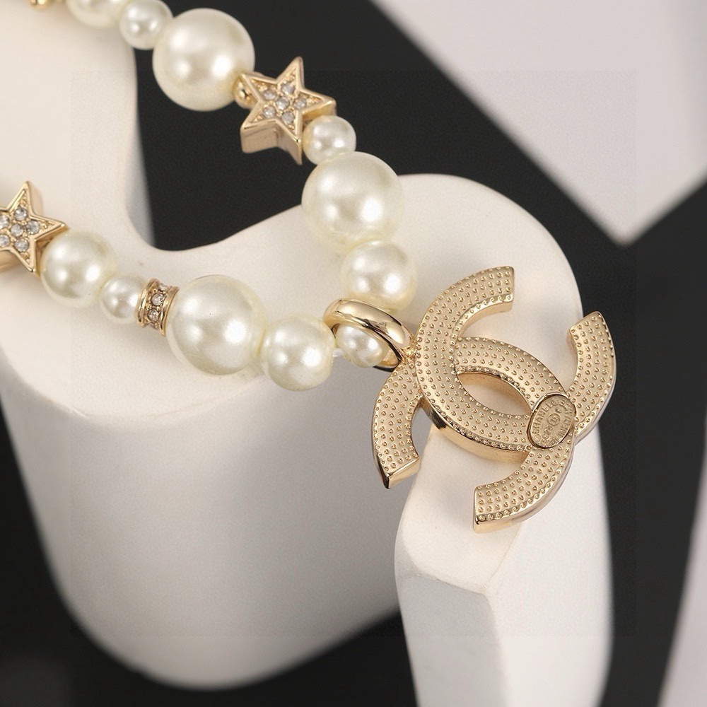 Chanel CC Logo Pearl Star Choker necklace Gold-tone metal white faux pearl clear crystal 40cm with 5cm extender chain
