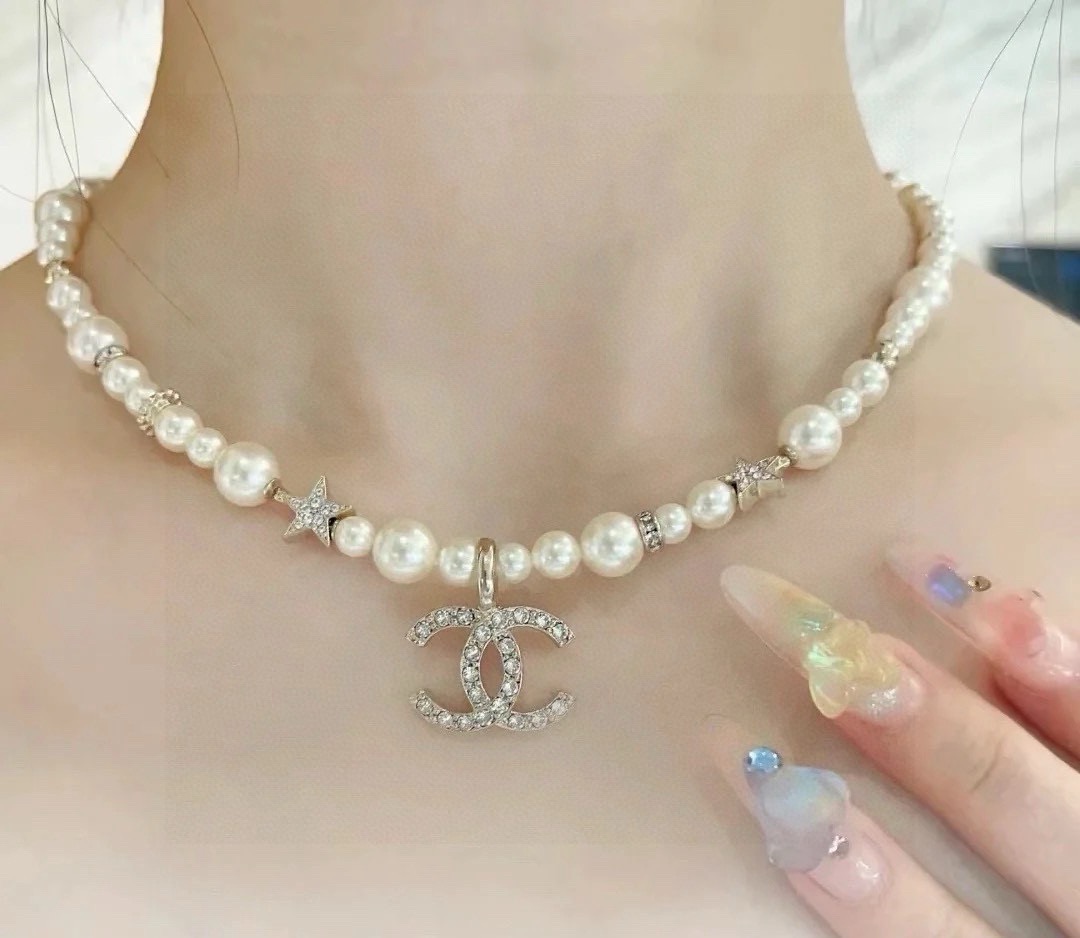 Chanel CC Logo Pearl Star Choker necklace Gold-tone metal white faux pearl clear crystal 40cm with 5cm extender chain