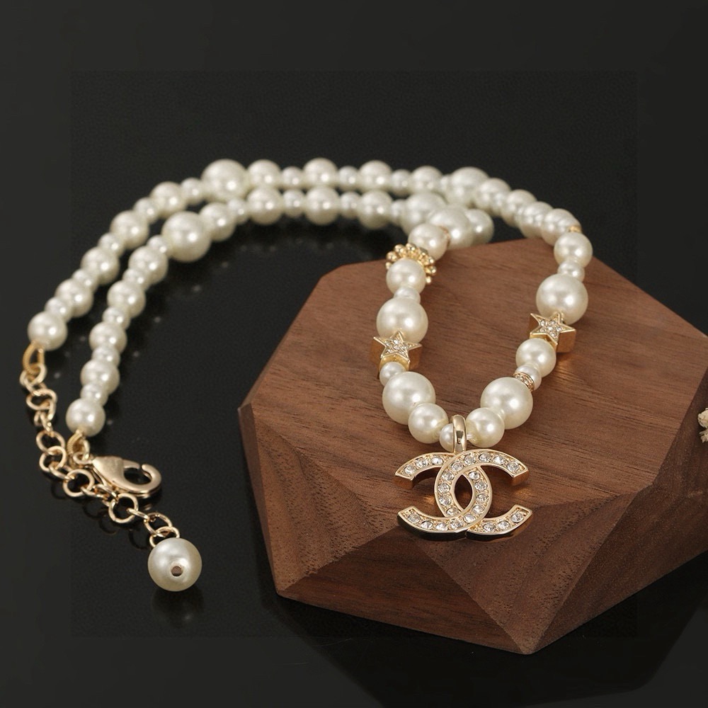 Chanel CC Logo Pearl Star Choker necklace Gold-tone metal white faux pearl clear crystal 40cm with 5cm extender chain