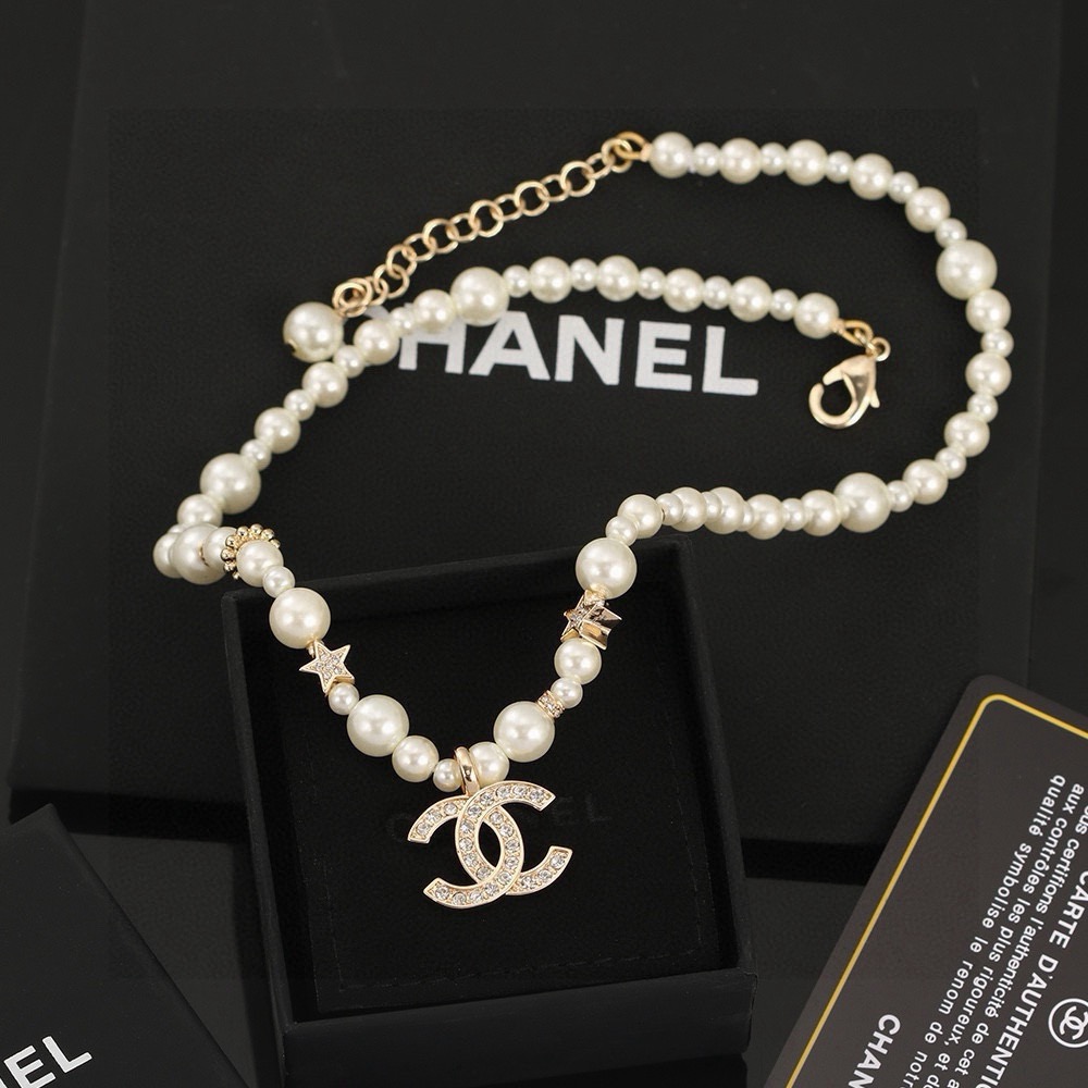 Chanel CC Logo Pearl Star Choker necklace Gold-tone metal white faux pearl clear crystal 40cm with 5cm extender chain