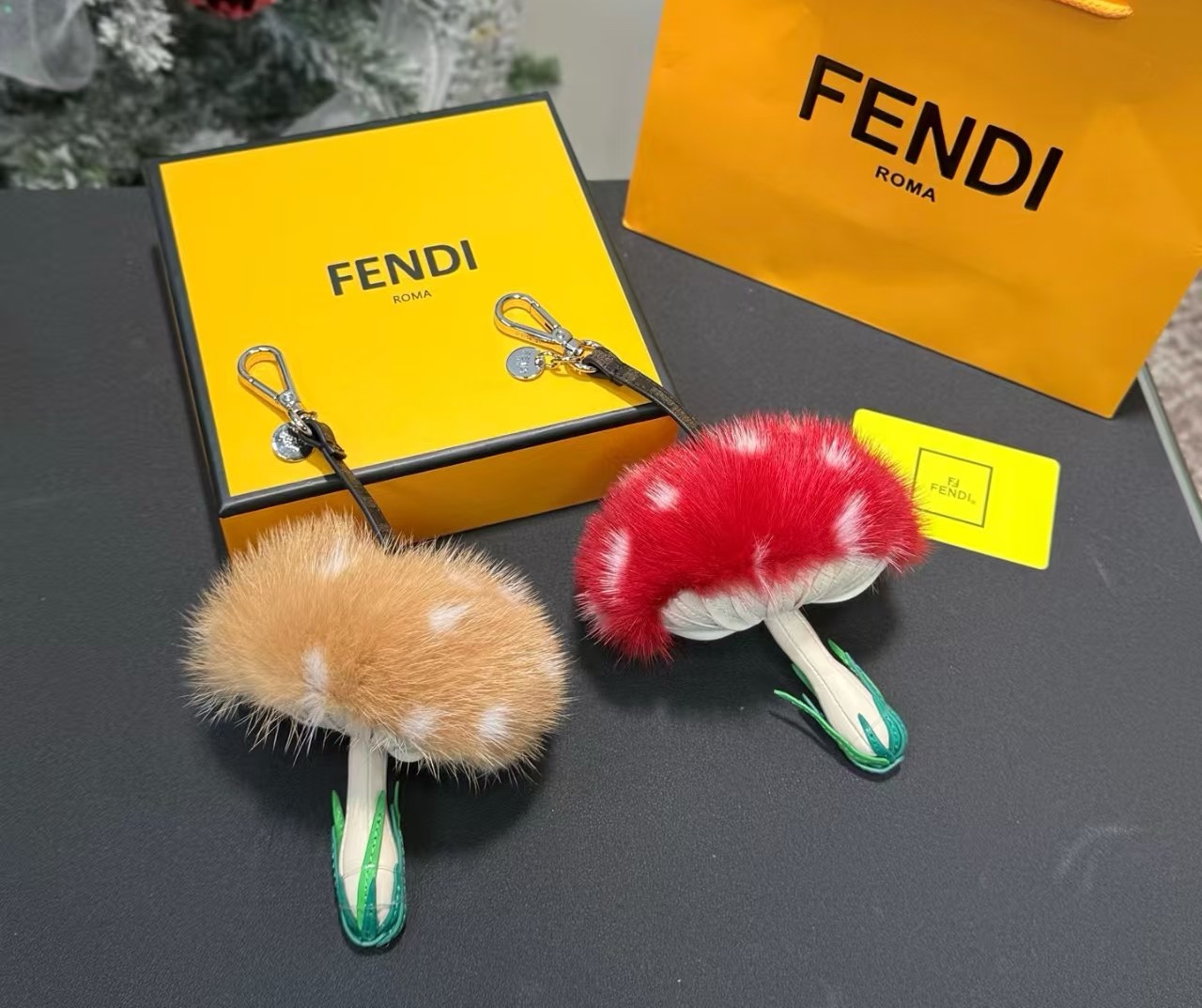 Fendi Mushroom Charm pendant Silver-tone metal brown FF coated canvas strap available in red mink fur with white spots or tan mink fur with white spots cream leather stem green leather grass detail 12cm total length