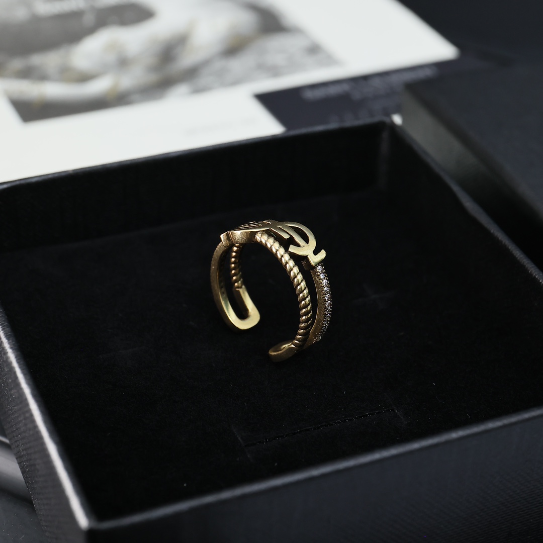 Saint Laurent Cassandre Twisted Open Ring ring antique gold-tone metal with clear crystal accents adjustable open band