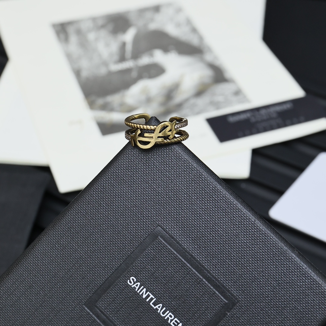 Saint Laurent Cassandre Twisted Open Ring ring antique gold-tone metal with clear crystal accents adjustable open band