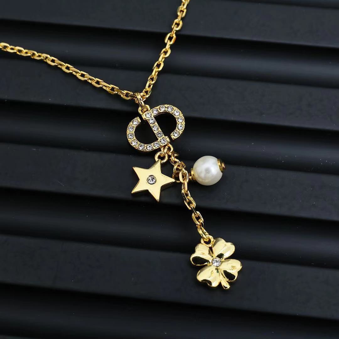 Dior Petit CD Lucky Charms Necklace necklace gold-tone metal with clear crystals white pearl and gold-toned star clover charms 42cm with 5cm extender chain