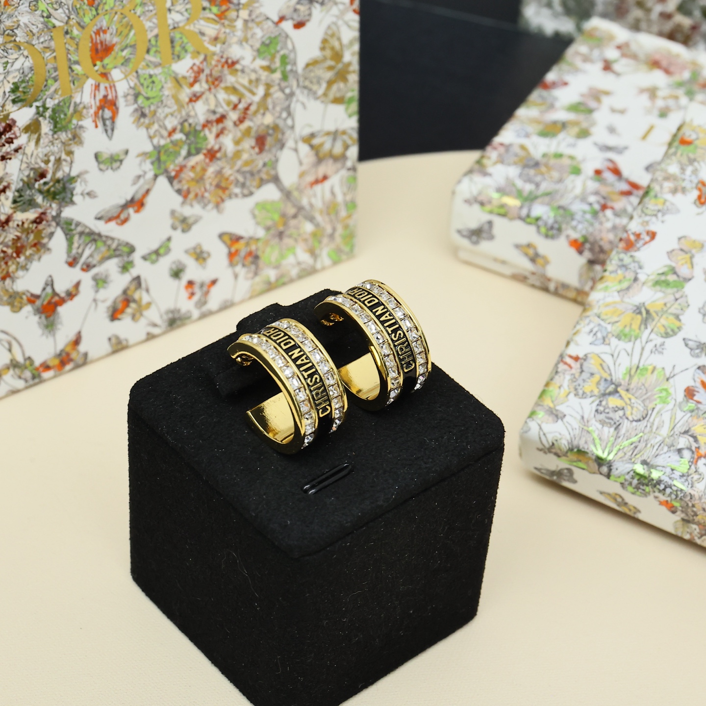 Dior Christian Dior Code Hoop Earrings earrings Gold-tone metal with clear crystal accents available in white enamel and black enamel variants 1 5cm outer diameter
