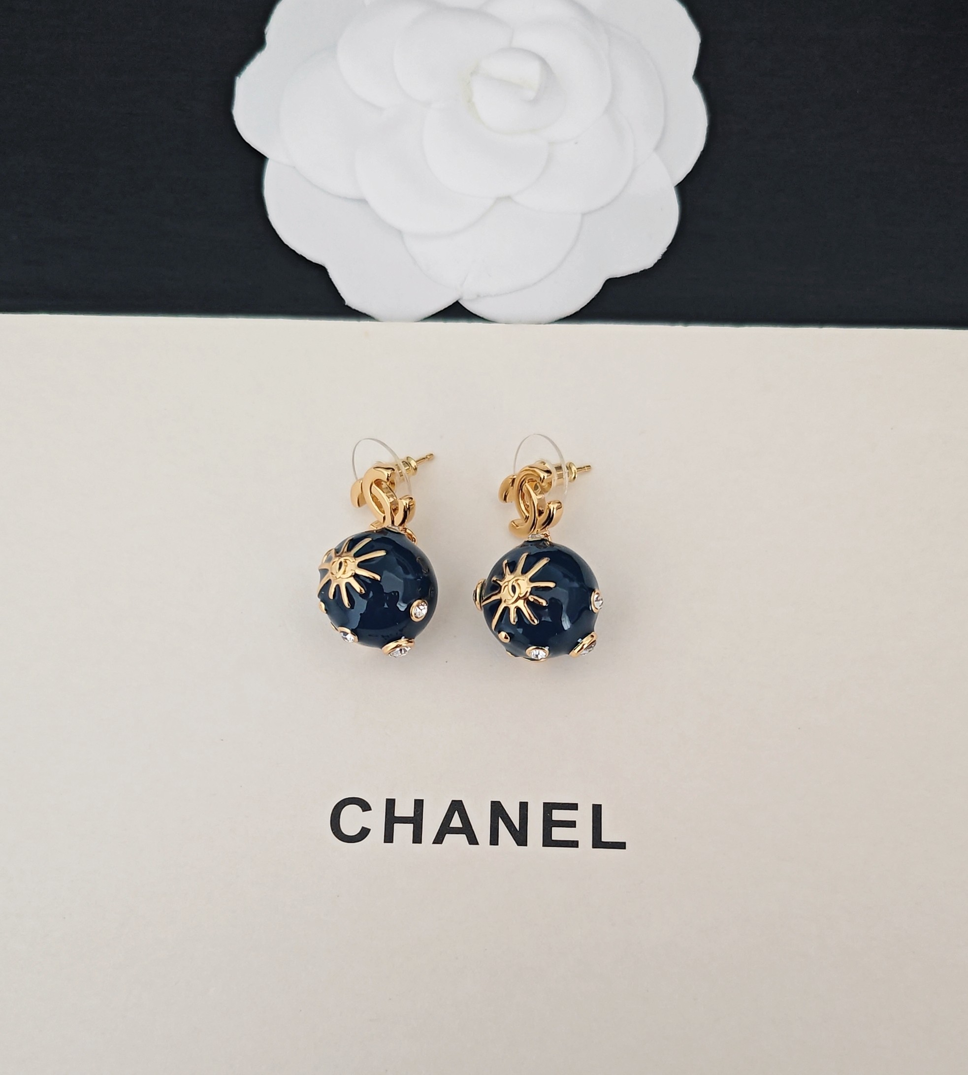 Chanel CC Sun Motif Resin Ball Drop Earrings earrings Gold-tone metal dark navy blue resin clear crystal accents One size drop length approx 2cm